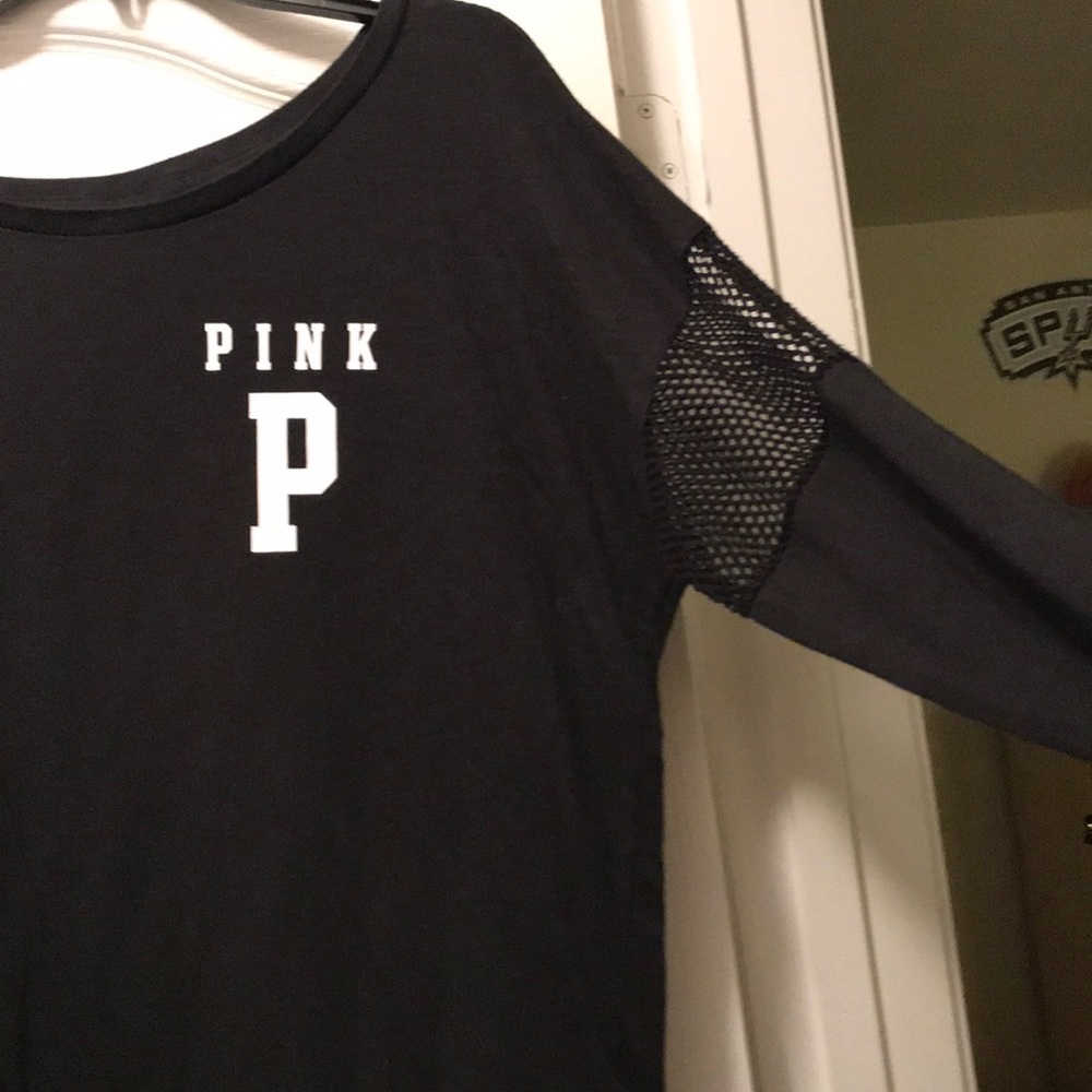 Black top with fishnet cut outs on arms